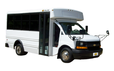 White Collins school bus with side mirrors.